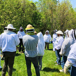 Mill Creek SApiary Hive Dive Participants listening to instructor