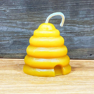 Candle shaped as a skep beehive from Mill Creek Apiary.