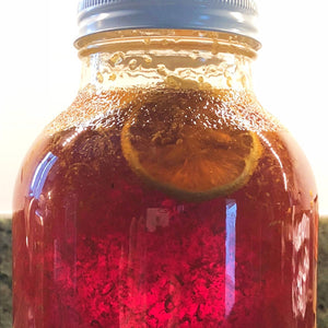 Lemons steeped in the honey to produce lemon infused honey from Mill Creek Apiary